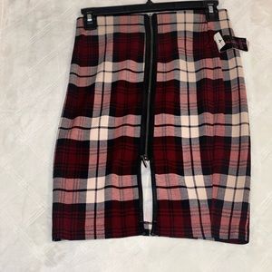 Red, Black, Tan plaid fall pencil skirt. Front leather zip detail/ closure.